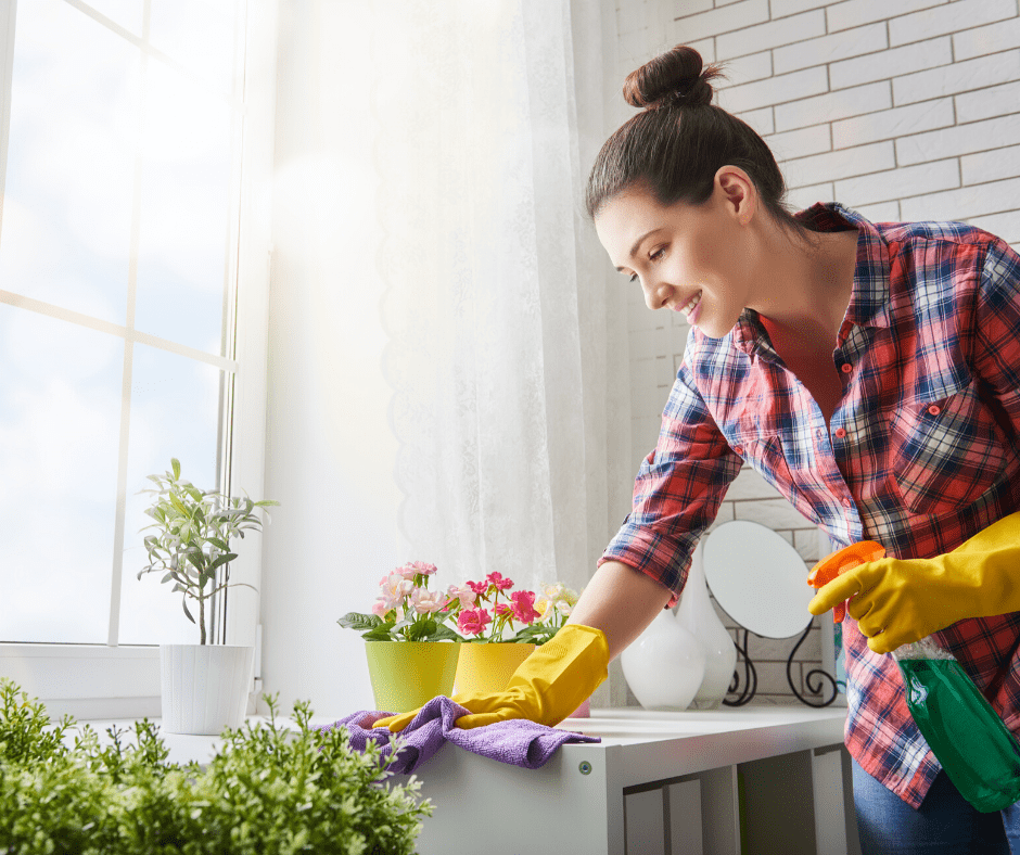 fun things to do at home: Woman cleaning kitchen 