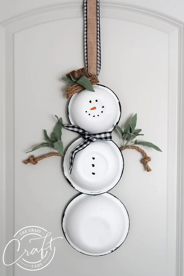32 Best Winter Craft Ideas for Adults to Try This Season 96 32 Best Winter Craft Ideas for Adults to Try This Season Farmhouse Style Snowman Door Hanger Wreath from The Crazy Craft Lady Winter Craft Ideas for Adults