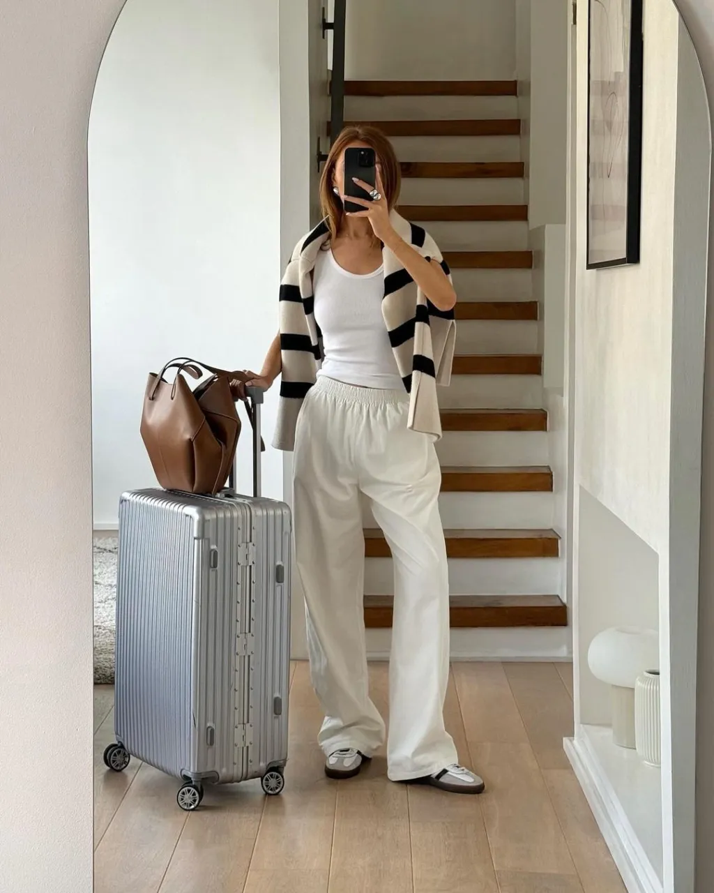 airport outfittrendy striped sweater with white lounge set classy comfortable airport outfit ideas Airport Outfit Ideas
