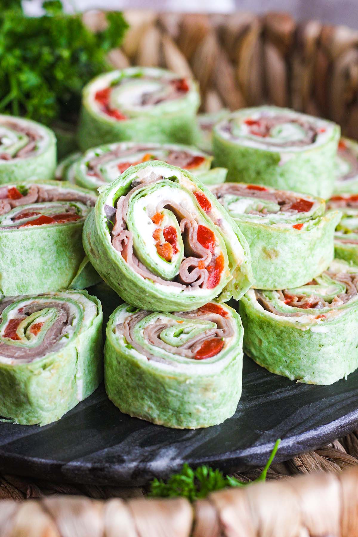 25 Pinwheel Recipes to try 47 25 Pinwheel Recipes to try Close up of stack of roast beef pinwheels on a tray with parsley in background