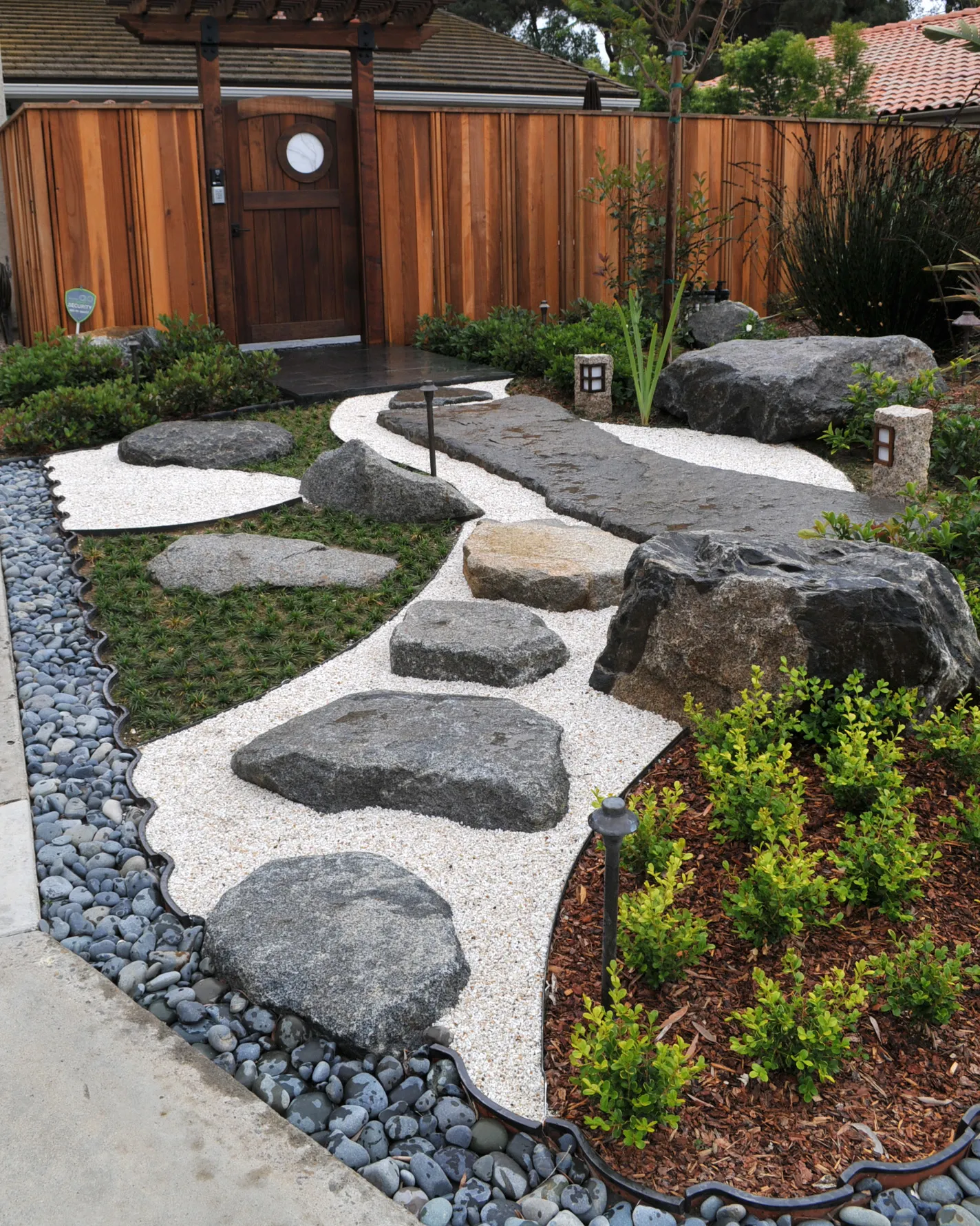 24 Japanese Garden Ideas for a Zen Backyard Retreat 59 24 Japanese Garden Ideas for a Zen Backyard Retreat Kohei rough back flagstone install 1 Japanese Garden Ideas