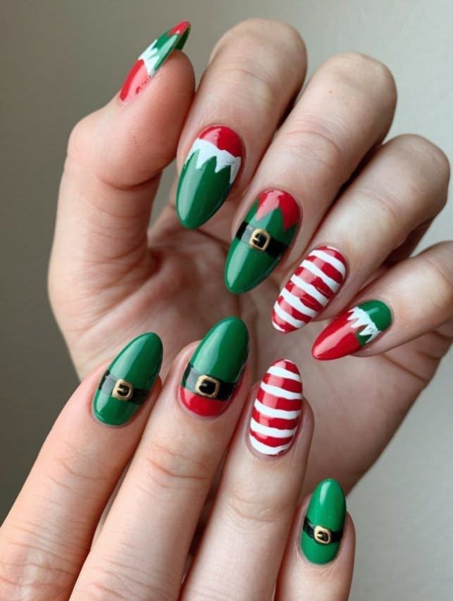 Green and red Christmas elf nails with candy cane stripes, elf hats, and gold belt buckle details