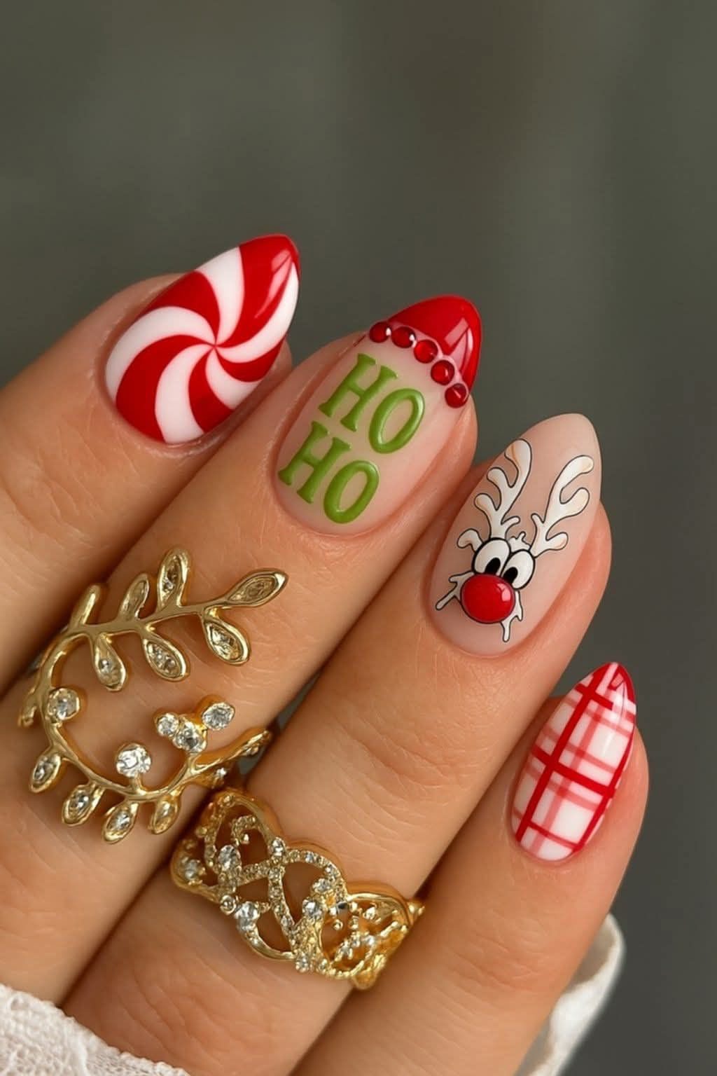 Pastel Christmas nails with pink and mint checkers, peppermint swirls, and a tiny Christmas tree car