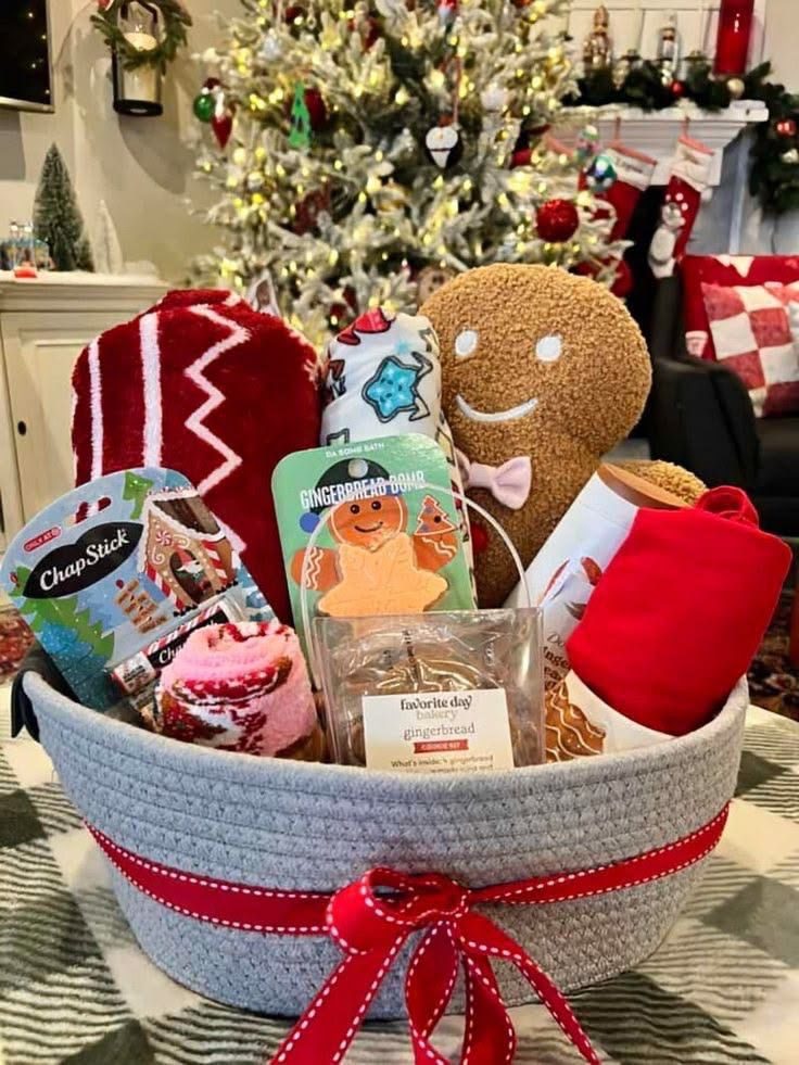 30 Thoughtful Christmas Gift Basket Ideas for Her 74 30 Thoughtful Christmas Gift Basket Ideas for Her Grey Christmas basket with a gingerbread plush, red cosy gifts, lip balm and festive treats