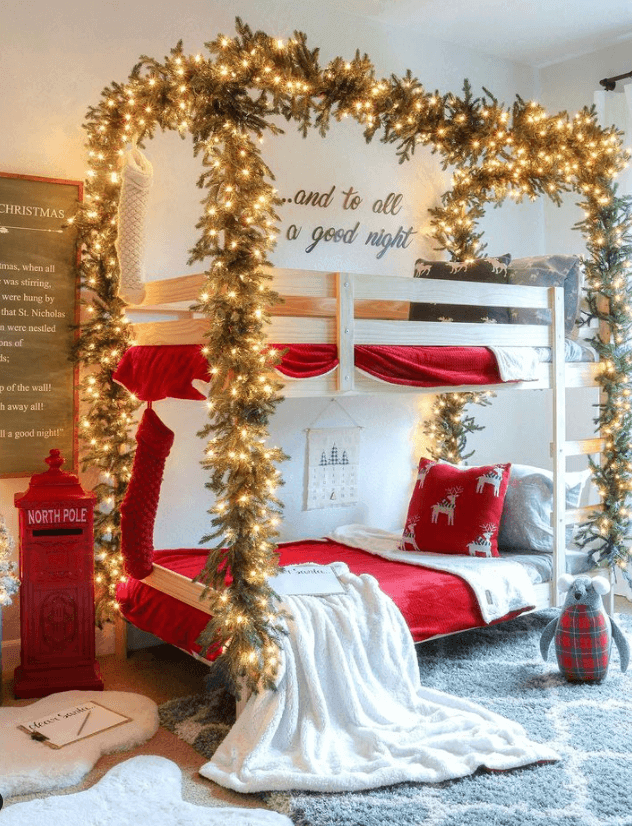 24 Magical Christmas Kids Bedroom Ideas They'll Absolutely Love 72 24 Magical Christmas Kids Bedroom Ideas They'll Absolutely Love Christmas bunk bed decorated with illuminated greenery and red stockings