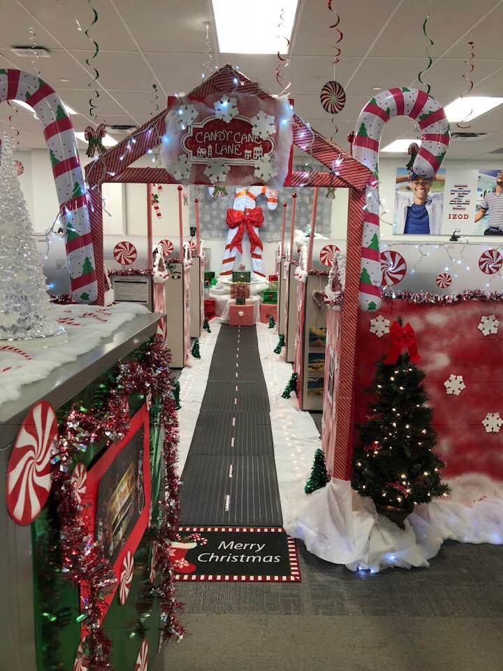 Candy Cane Lane Christmas office entrance with giant candy canes, peppermint decorations and Christmas trees