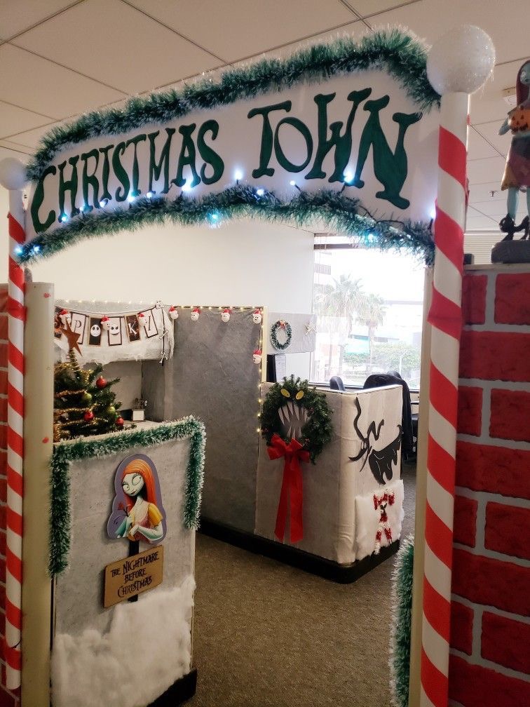 Nightmare Before Christmas-themed office cubicle entrance with Christmas Town arch and character decorations