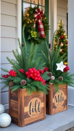 Personalised wooden Christmas porch planters with names, evergreen branches, red berries and pinecones