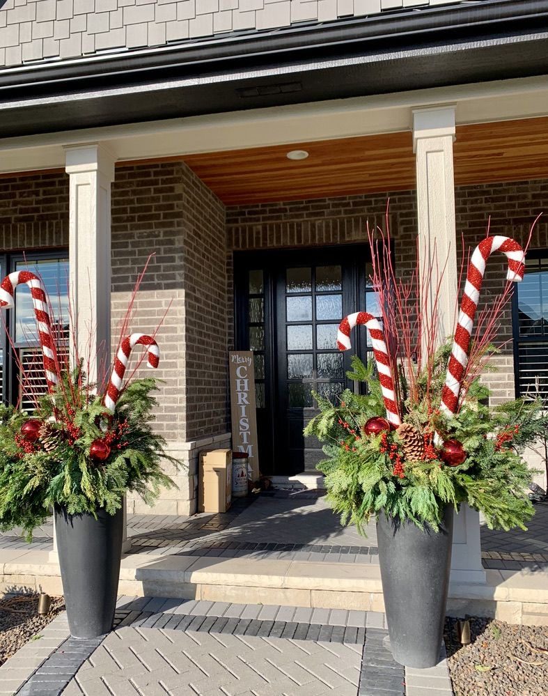 Rustic Christmas planter display with winter greenery and woodland-inspired decorative details