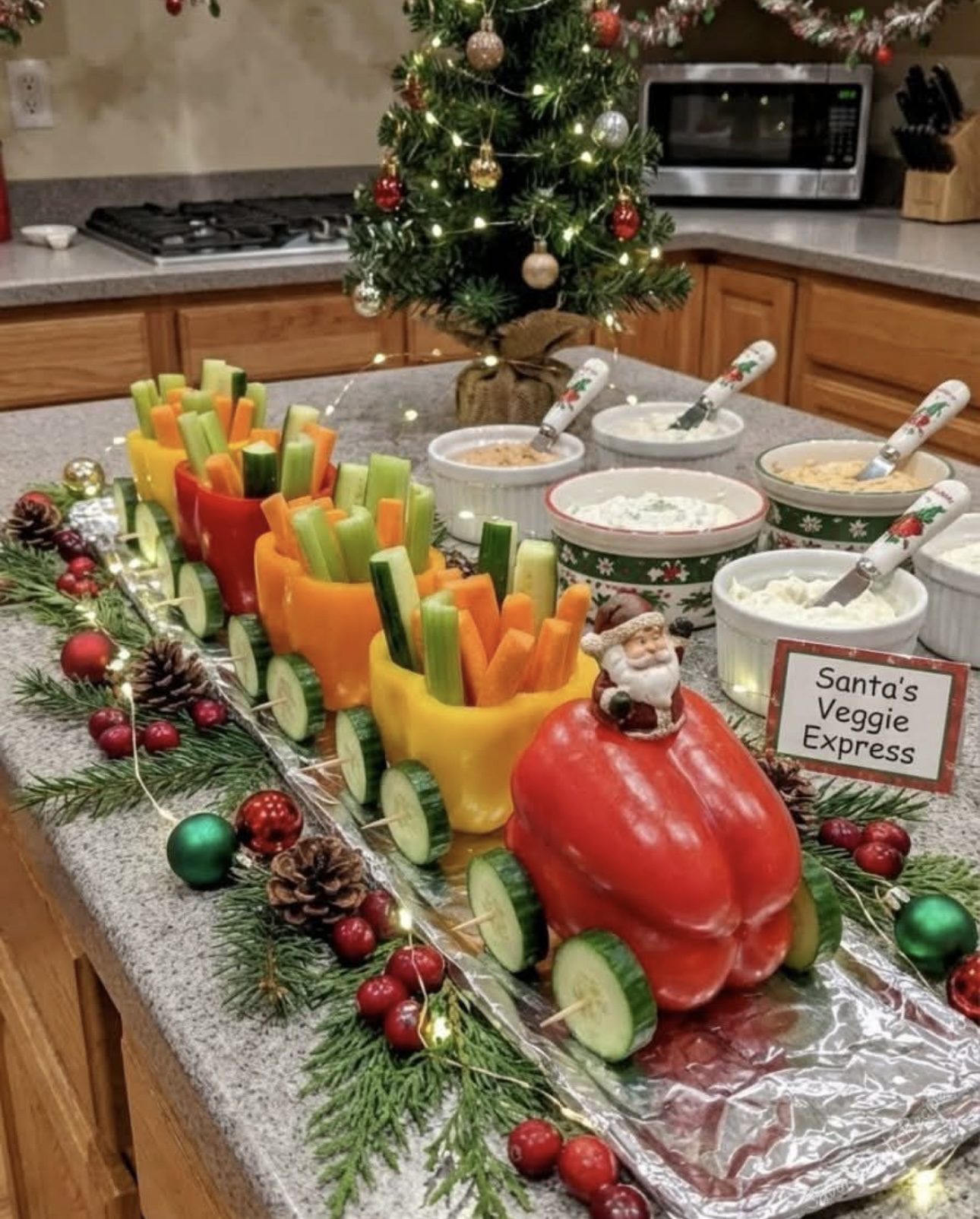 Santa's Veggie Express train made from red, orange and yellow bell peppers filled with carrot, cucumber and celery sticks