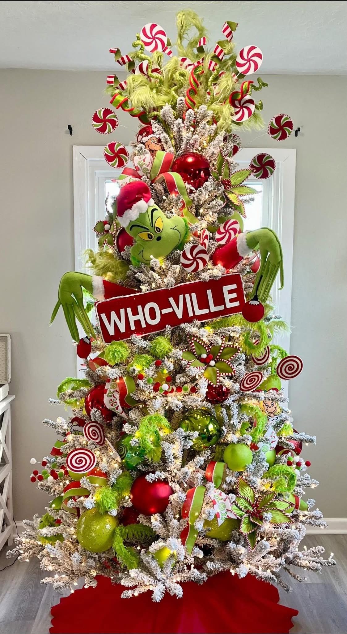 24 Fun Grinch Christmas Tree Ideas You'll Love 61 24 Fun Grinch Christmas Tree Ideas You'll Love Flocked Grinch Christmas tree with giant Who-Ville sign, Grinch head and peppermint decorations