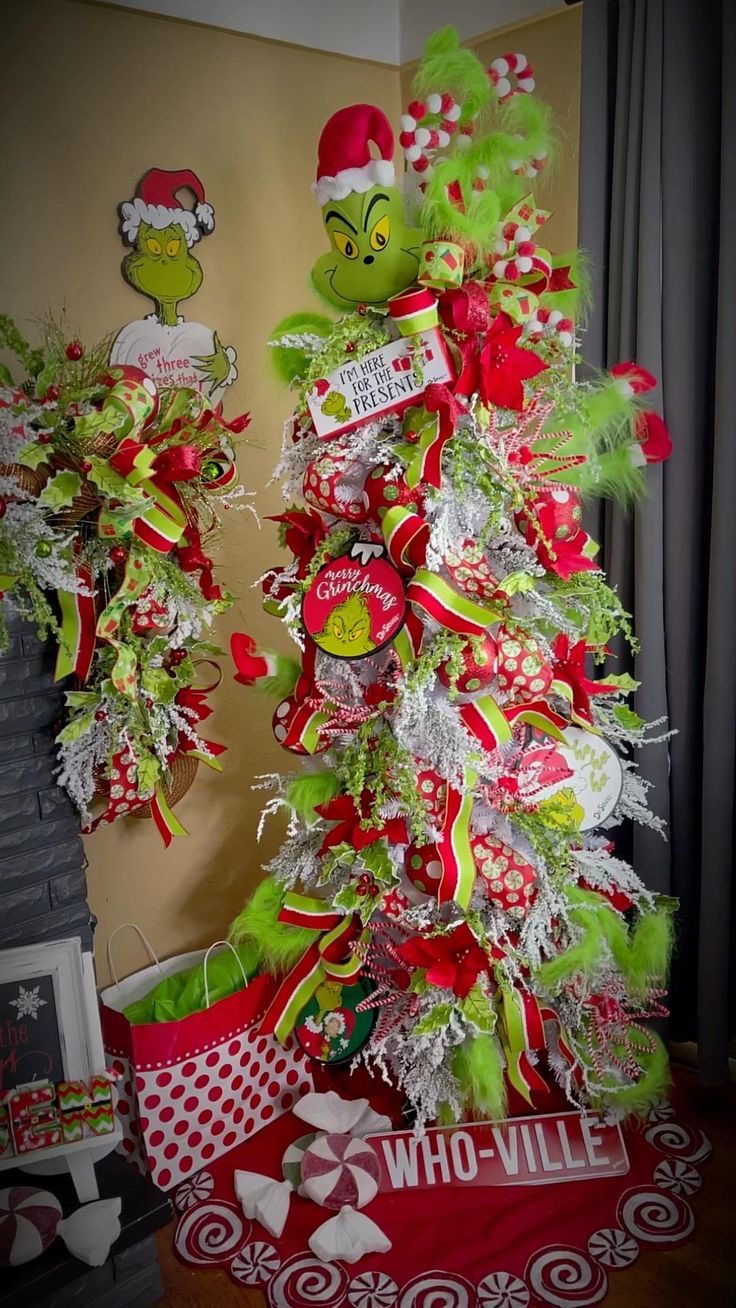 24 Fun Grinch Christmas Tree Ideas You'll Love 62 24 Fun Grinch Christmas Tree Ideas You'll Love Grinch Christmas tree with oversized peppermint topper, red and green ribbons and lime green tree skirt