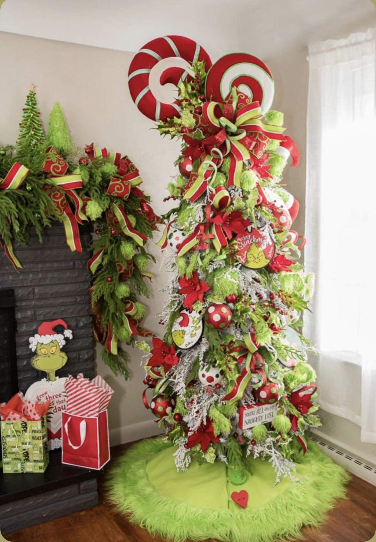 24 Fun Grinch Christmas Tree Ideas You'll Love 63 24 Fun Grinch Christmas Tree Ideas You'll Love Grinch Christmas tree with Merry Grinchmas signs, peppermint ornaments and green furry accents
