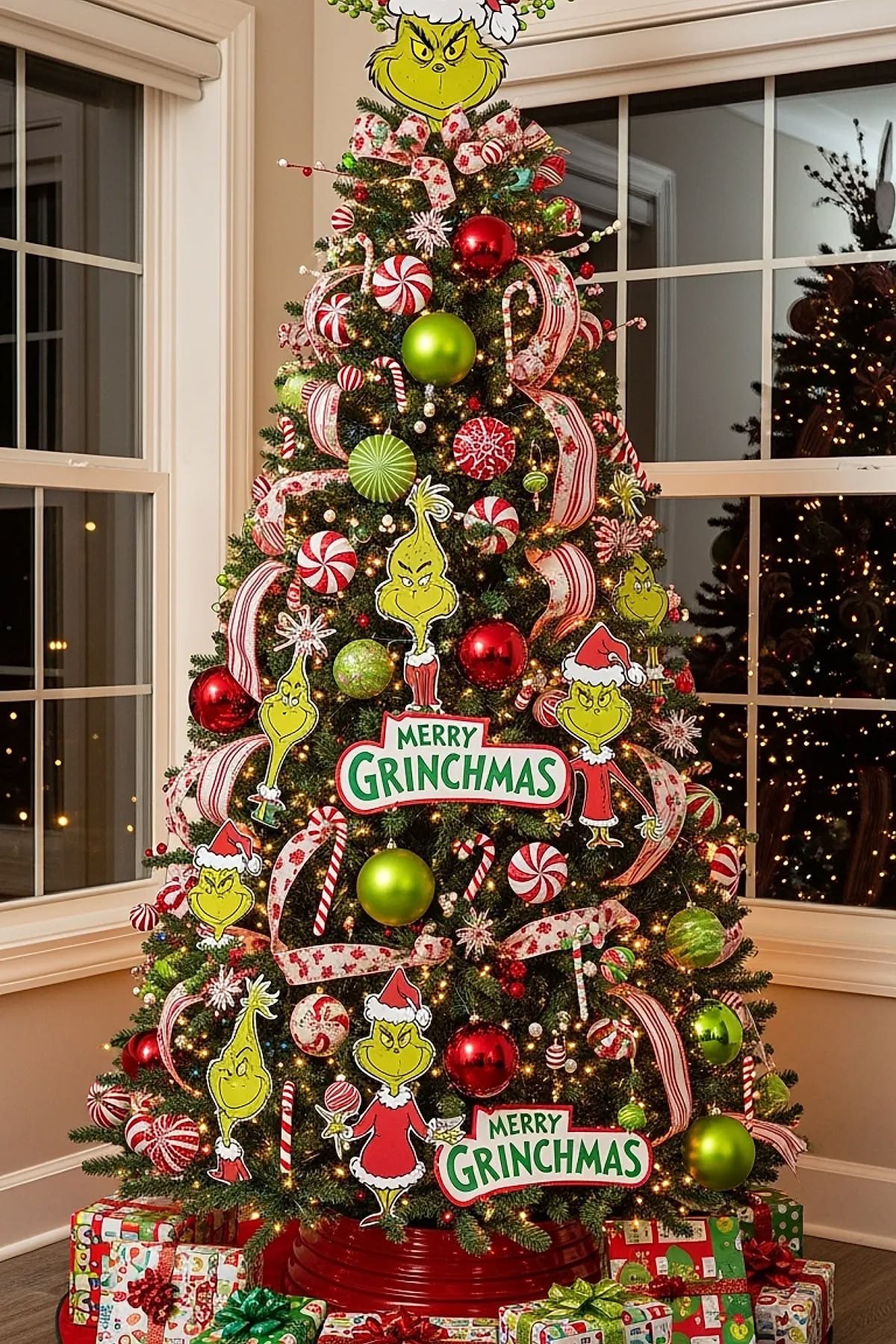 24 Fun Grinch Christmas Tree Ideas You'll Love 52 24 Fun Grinch Christmas Tree Ideas You'll Love Grinchmas Christmas tree decorated with Grinch character cutouts, peppermint ornaments and festive signs